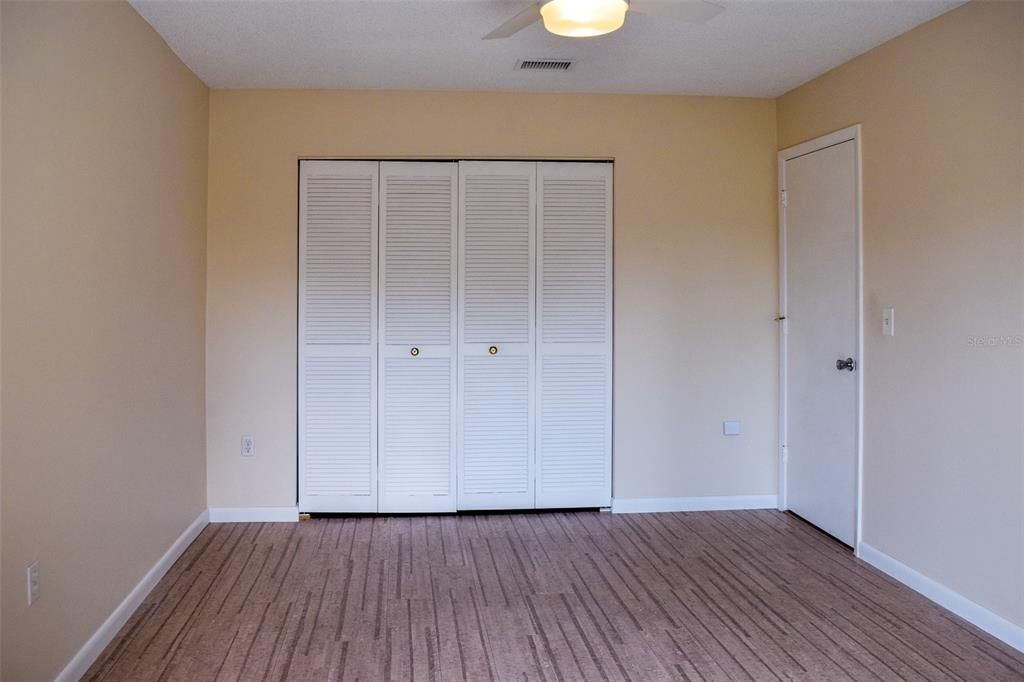 The large second bedroom opens up to the back patio.