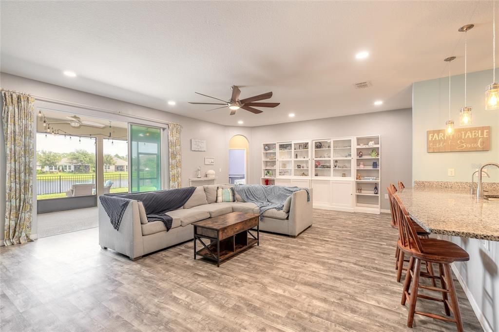 living room with triple-slider to screened backporch