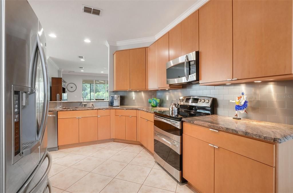 PLENTY OF STORAGE IN MAPLE WOOD CABINETS