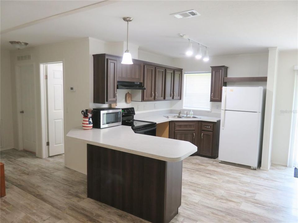 Open kitchen, upgraded cabinets. Lots of natural light.