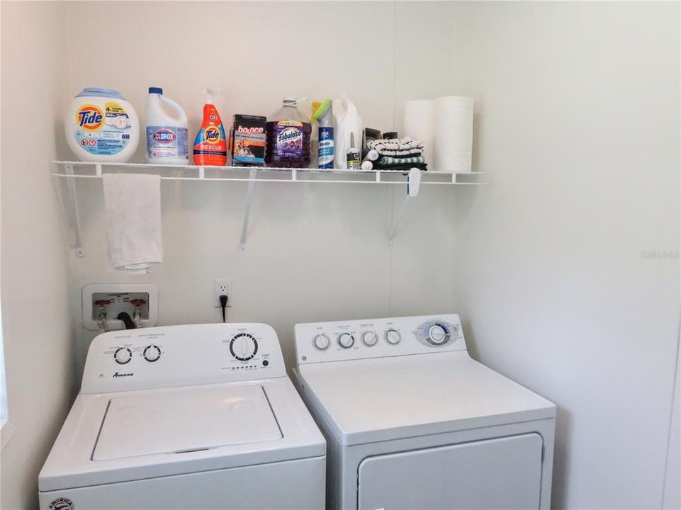 Shelf above Washer & Dryer holds all your cleaners out of the way.