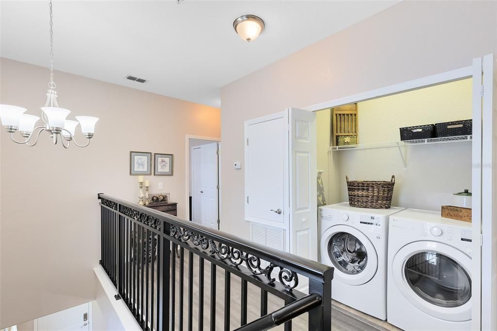 The second floor landing houses your laundry closet.