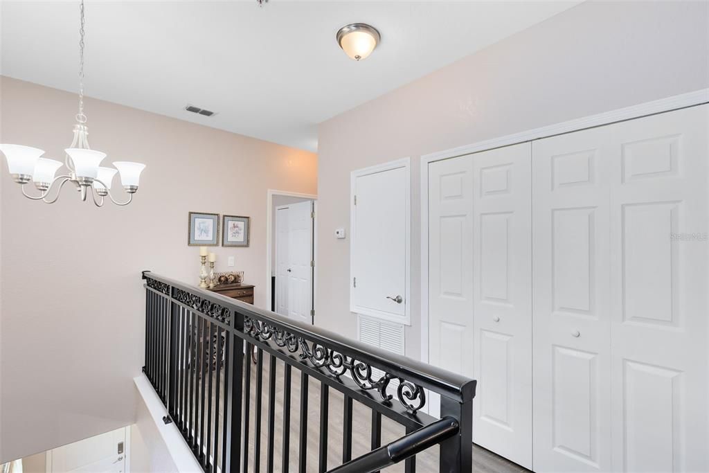 The second floor landing houses your laundry closet.