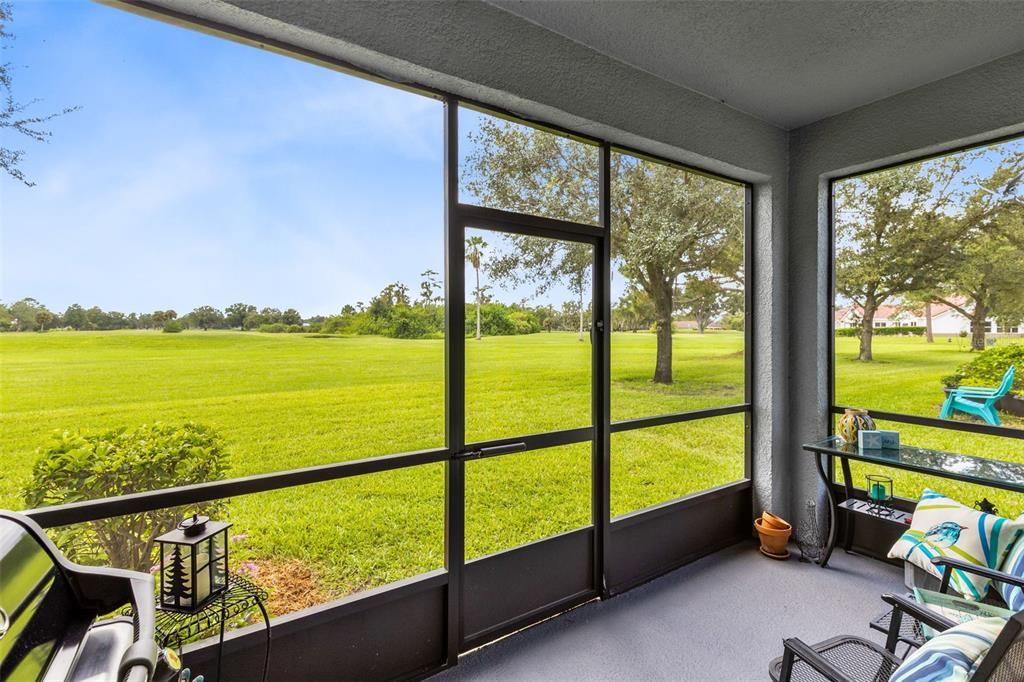 The screened lanai invites you to relax and take in the amazing golf course scenery.