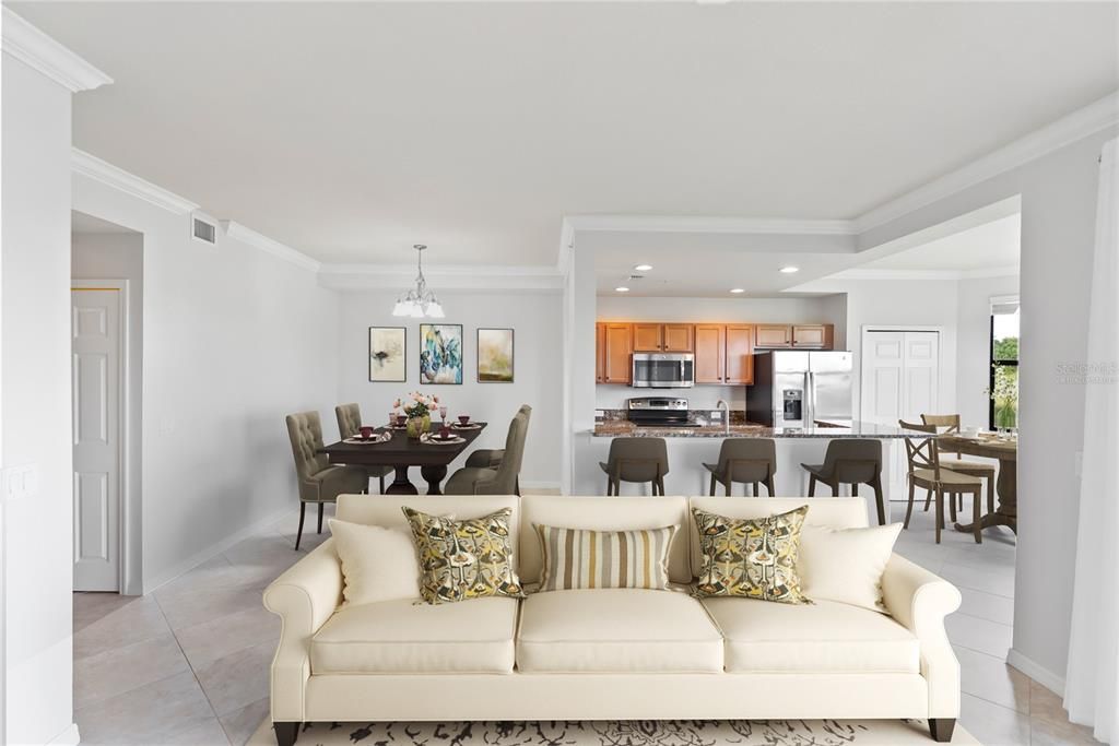 Living Room in foreground, from left to right in the background you have the Dining Room, Kitchen (with eat-in countertops) and Breakfast Nook area (Virtually Staged)