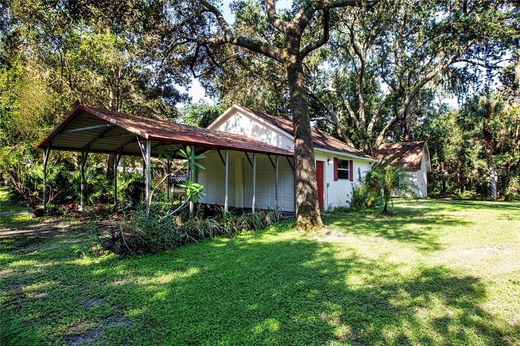 22x12 carport and oversized 22x22 detached garage/workshop