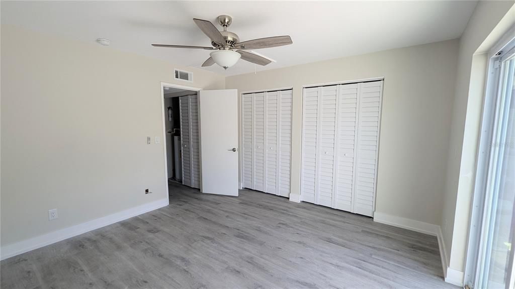 Primary Bedroom New flooring and ceiling fan