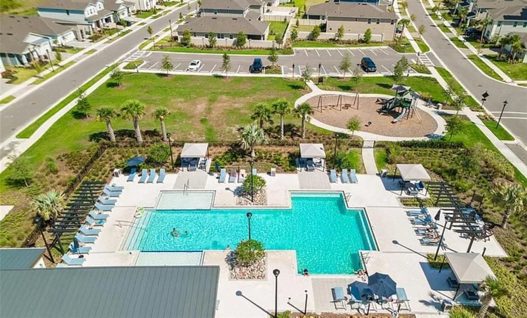 community pool with lounge area