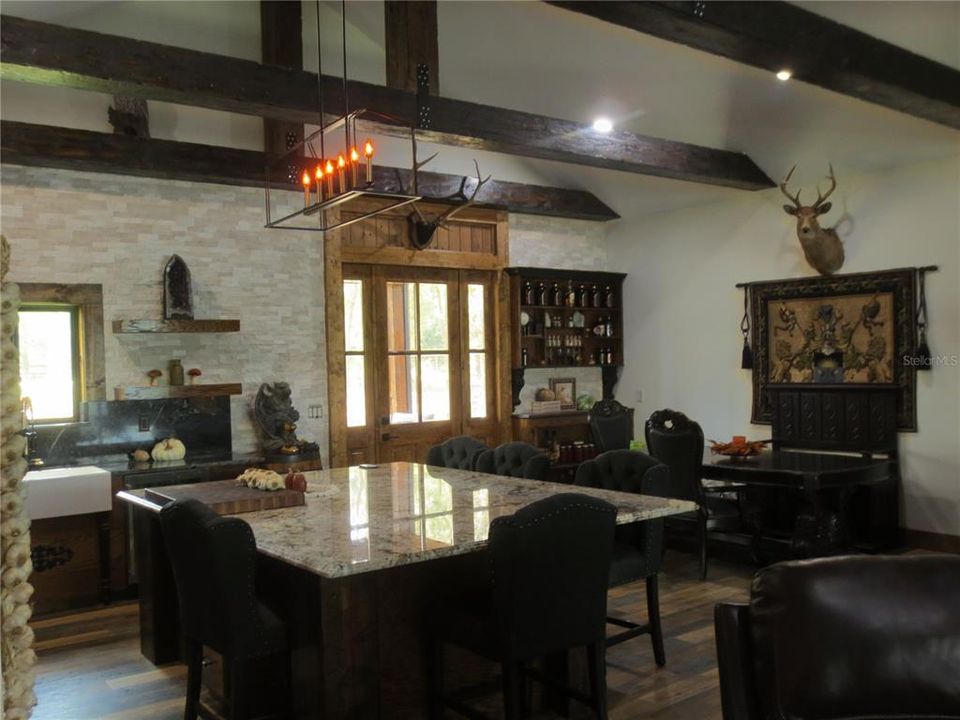 Huge kitchen with solid wooden front door.