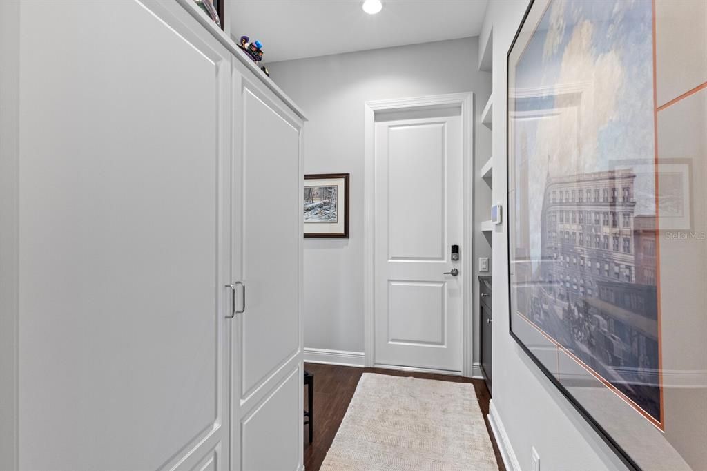 Hallway looking toward the garage - built-in storage