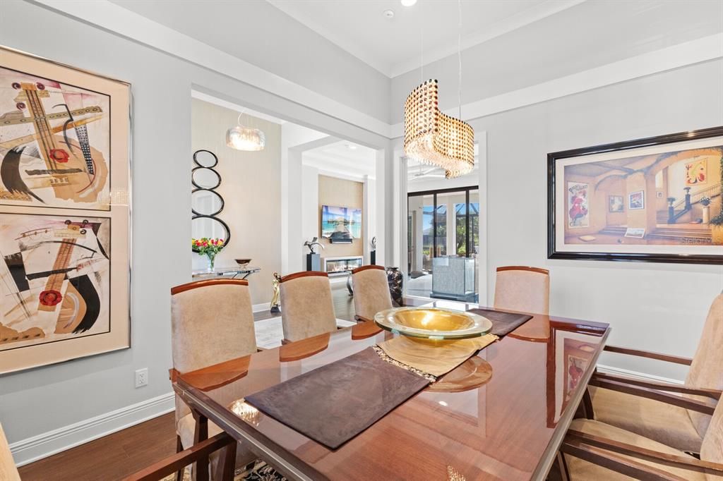 A fabulous formal dining room which could be enclosed if you prefer another front den/office