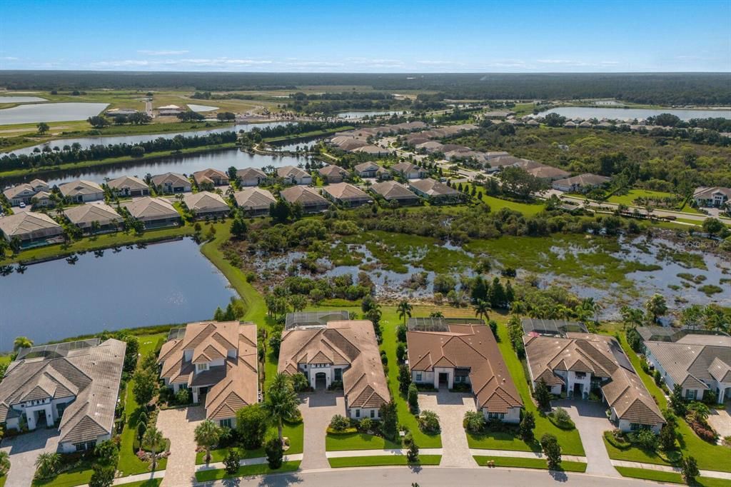 Beautiful overhead view of the community and highlights the privacy and green space behind.