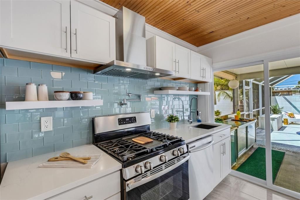 Wood cabinets, quartz counters, & natural gas stove~