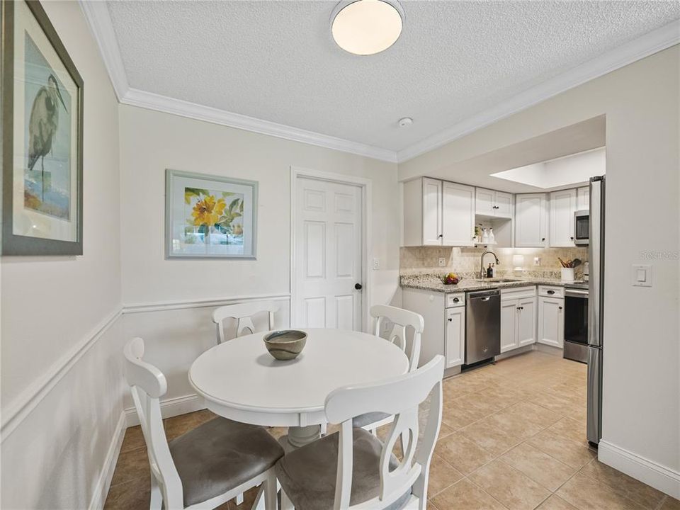 Dining area is open to the beautifully updated kitchen~