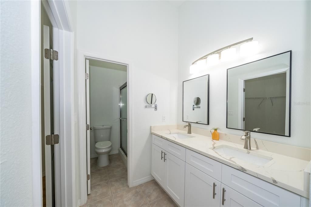 large master bath walk-in shower double sinks