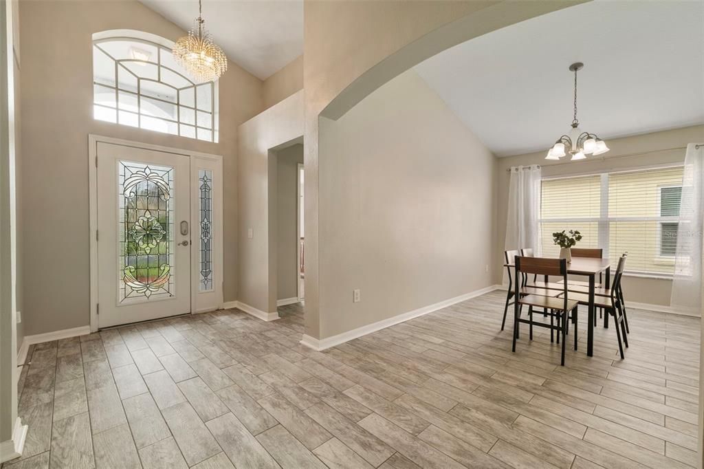 Foyer entry with ceramic tile flooring