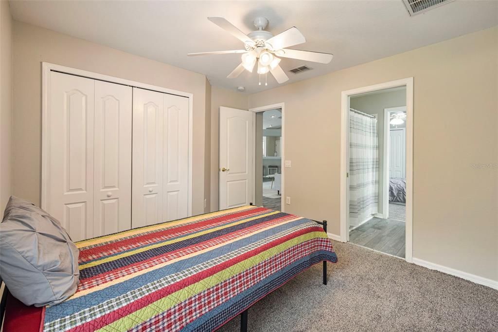 Bedroom 4 with Pocket Door leading to Jack and Jill Bathroom