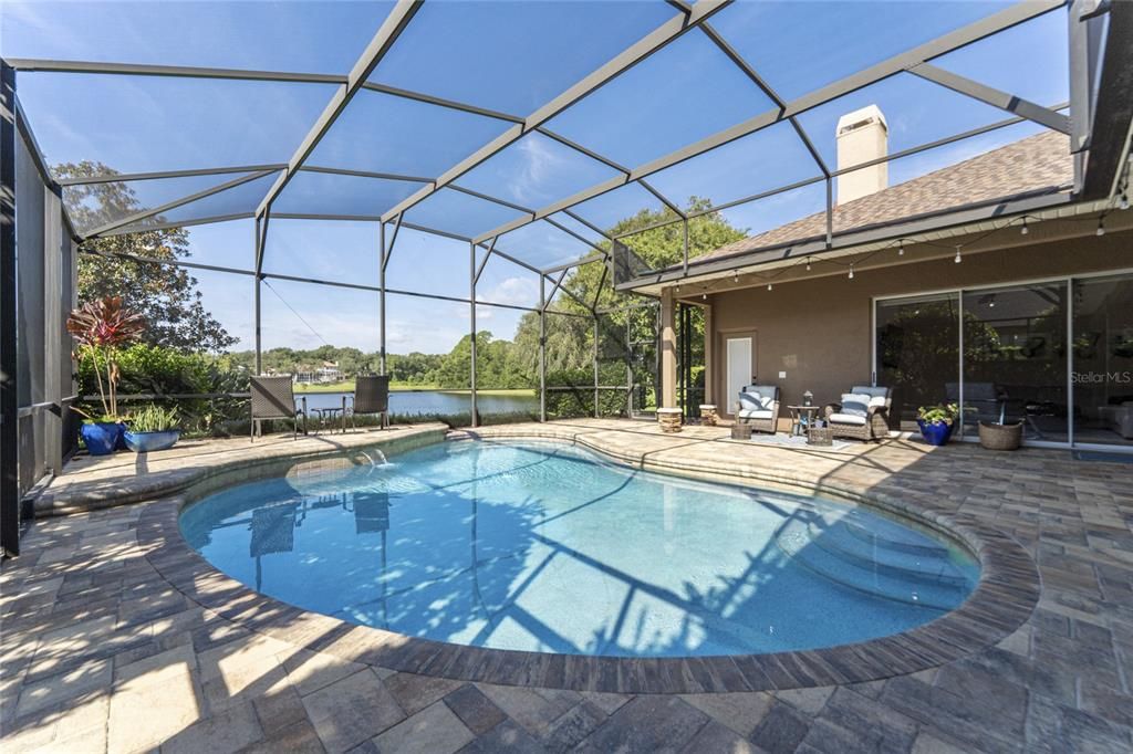 Screened pool overlooking lake