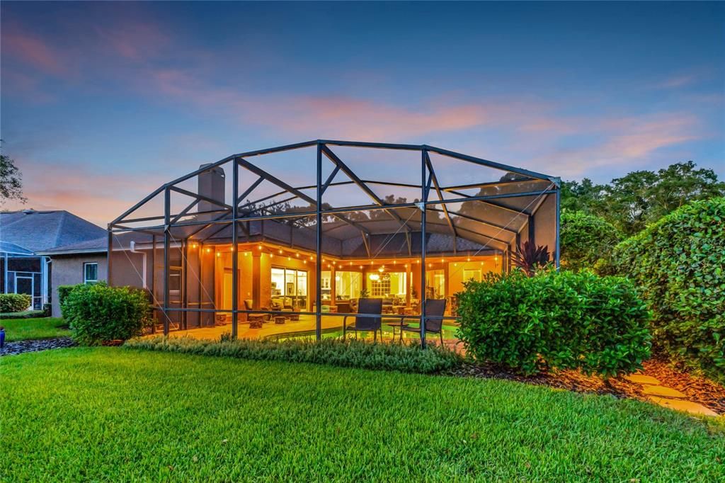 Twilight view of rear of home