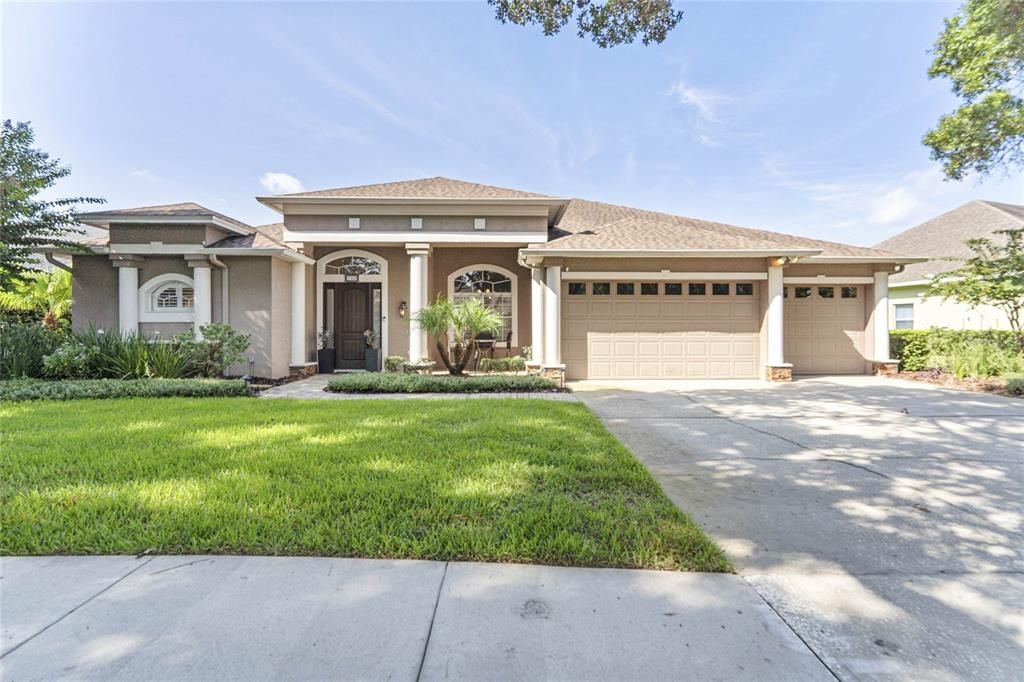 Front view with 3 car garage