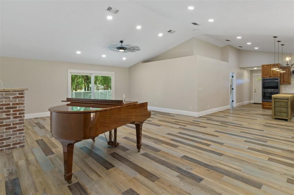 View from dining area to living room and kitchen.