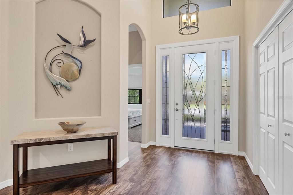 Large open foyer with a custom design double door closet