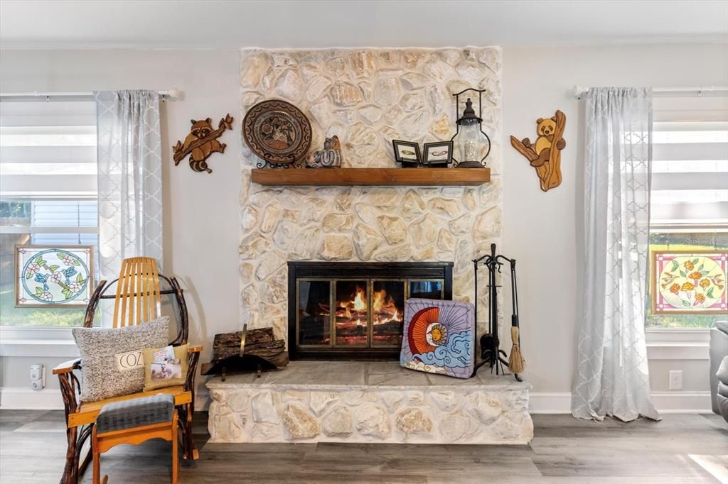 Family Room w/ Wood Burning Fireplace and Stone Surround