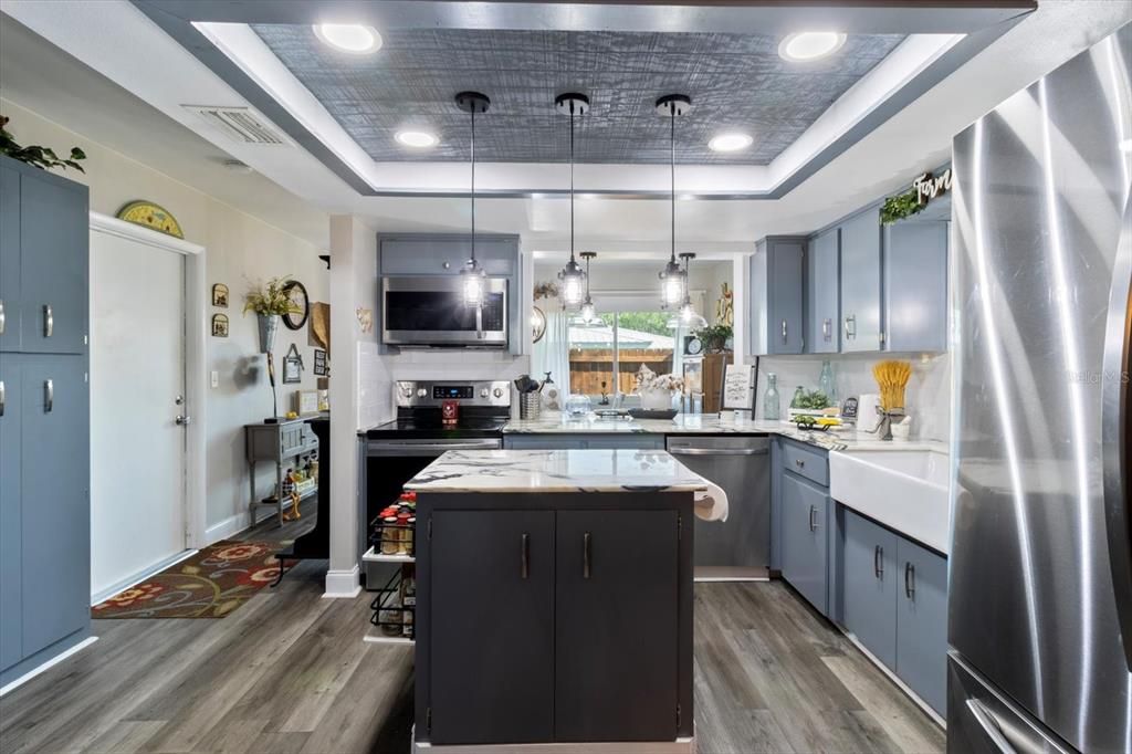 Kitchen... Marble Style Quartz Countertops, White Subway Tile Backsplash, S/S Appliances, Island & Farmhouse Sink