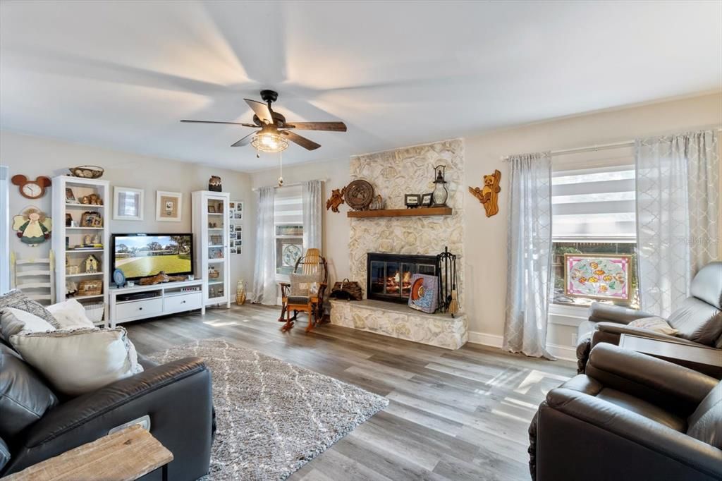 Separate Family Room w/ Wood Burning Fireplace & Luxury Vinyl Planking Throughout