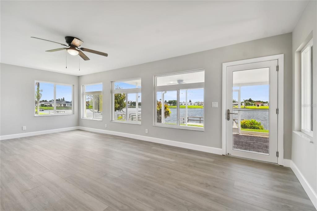 Florida room is lined with newer windows and allows for a panoramic view of Lake Simmons.