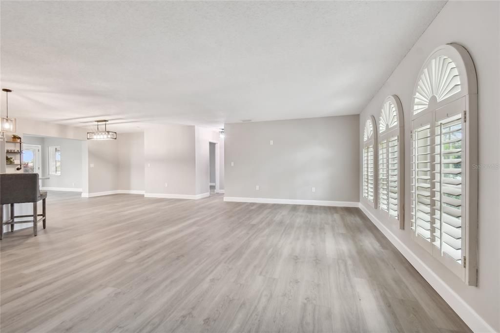 The custom plantation shutters allow for lots of natural light in the family room.