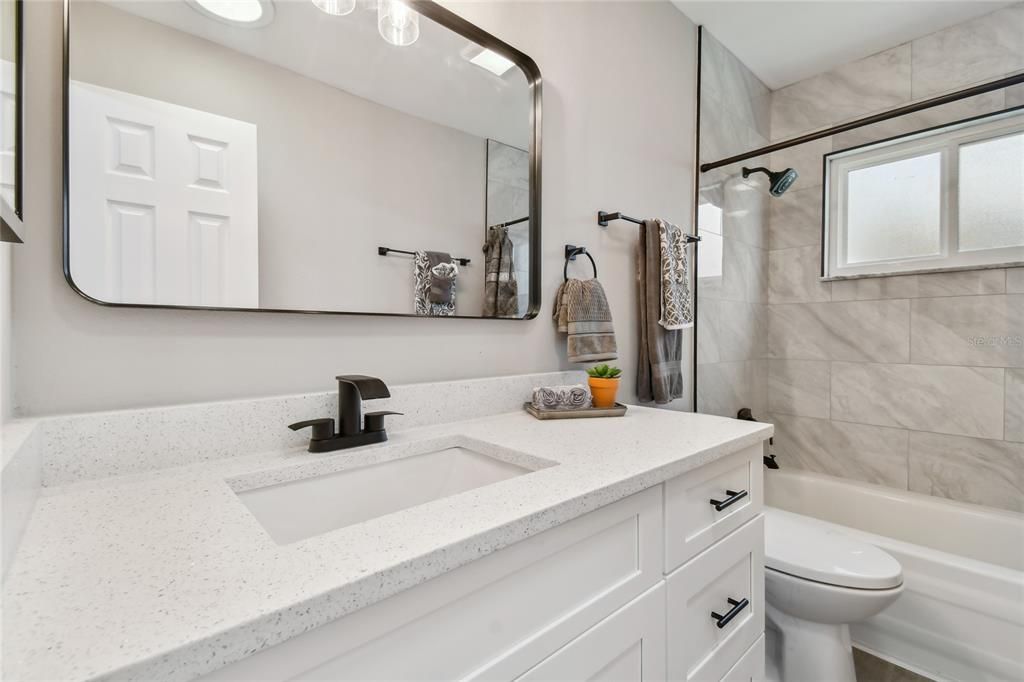 Bathroom #2 has been completely remodeled as well.....new vanity, quartz countertop, faucet, light, mirror, toilet, shower tile and medicine cabinet.