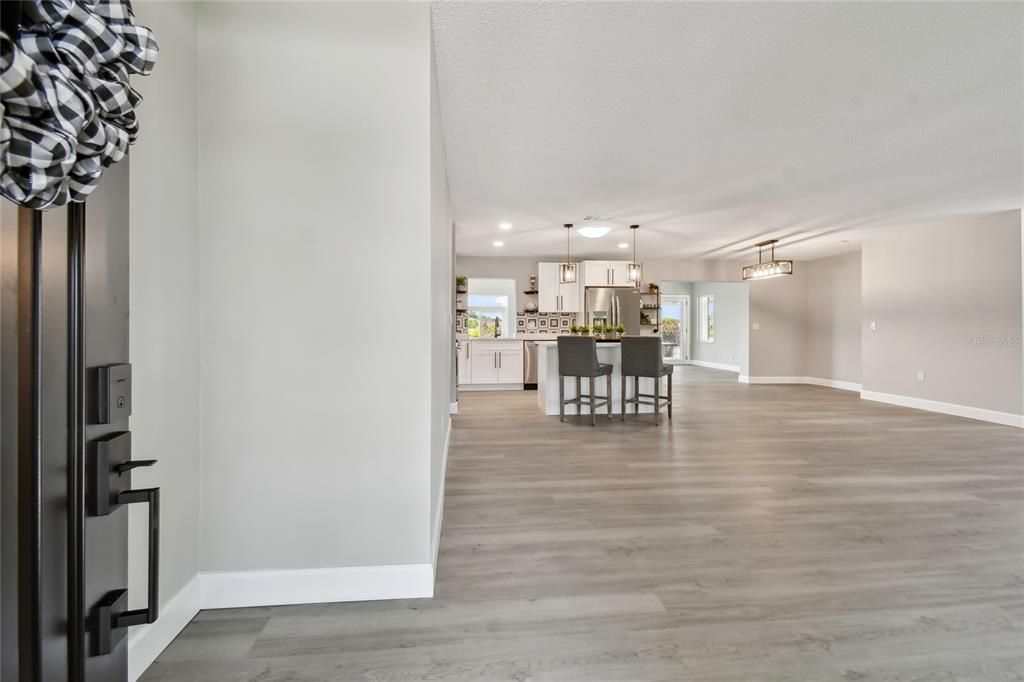 As you walk through the front door, you enter into the new open floor plan....family room/kitchen/ and dining room will be great for all your entertaining needs.