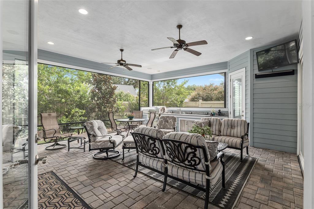 OVER-SIZED LANAI WITH BRICK PAVERS AND SUMMER KITCHEN AREA