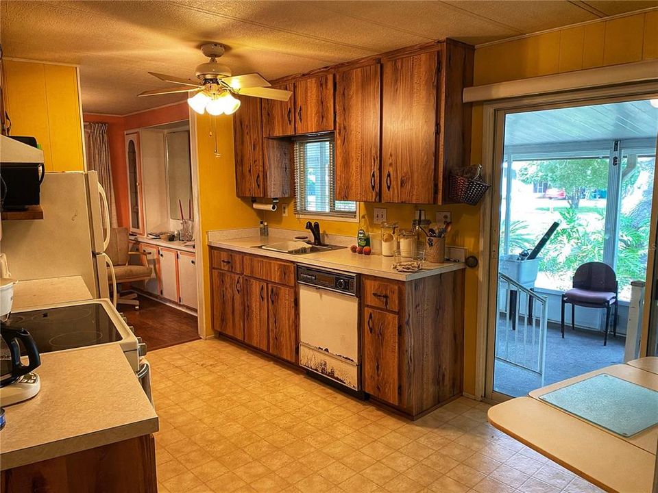 This sliding glass door goes out into the side screened in porch.