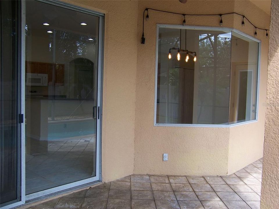 LOOKING INTO THE DINING ARE FROM THE POOL DECK