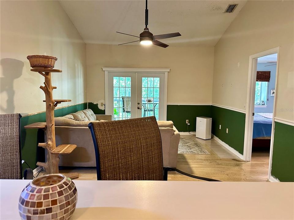 Breakfast Bar Overlooking dining/living room combo leading to french doors/patio