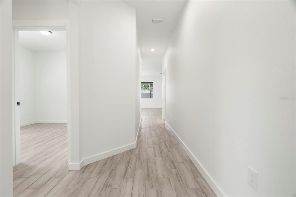 Hallway showing split floor plan