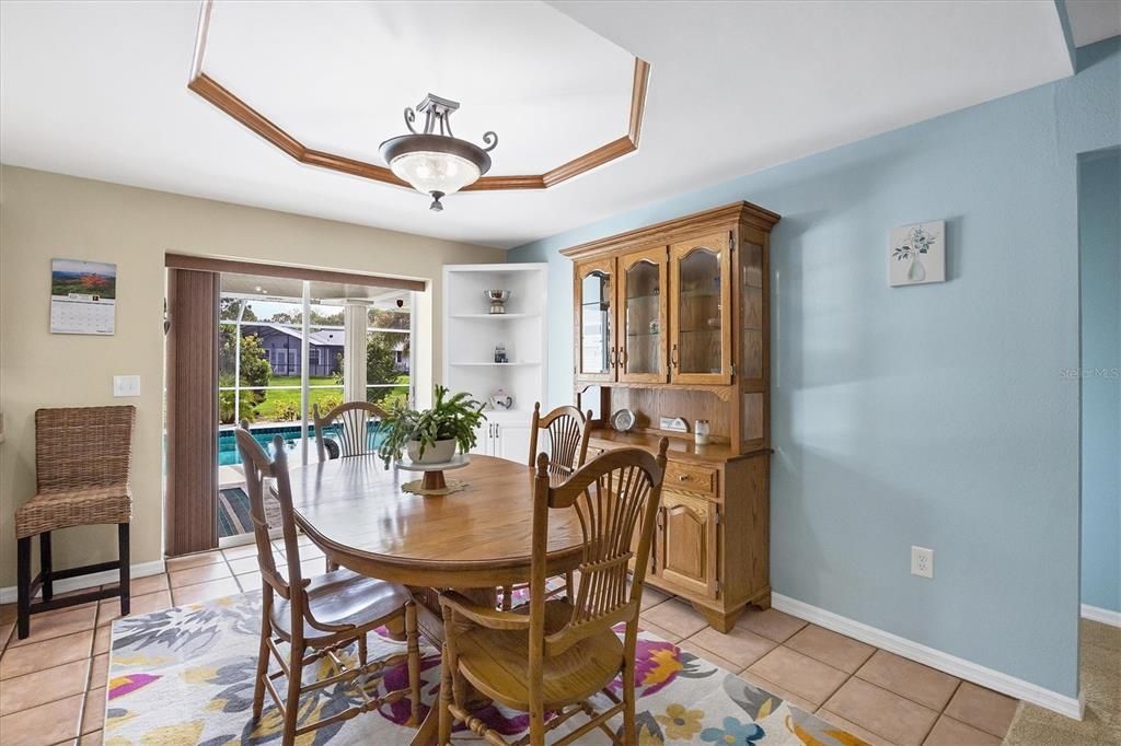 Dining Room w/slider to lanai and HEATED POOL!