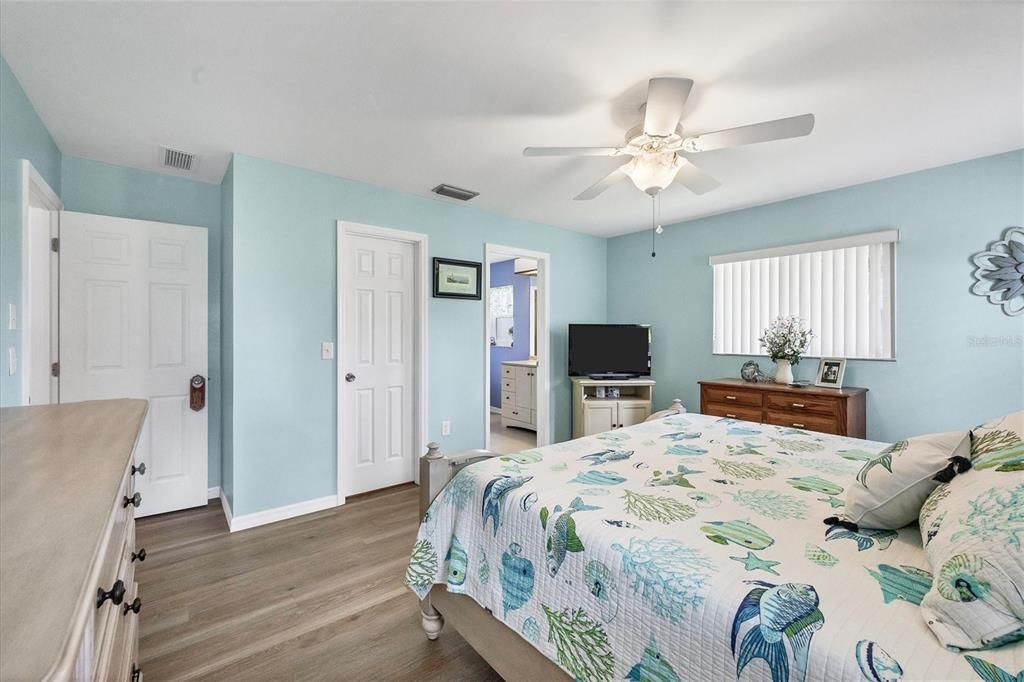 Primary Bedroom w/view into bathroom