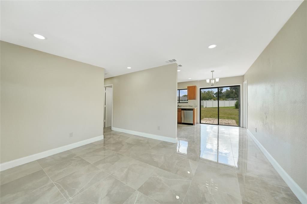 LIVING ROOM VIEW TO DINING AND KITCHEN