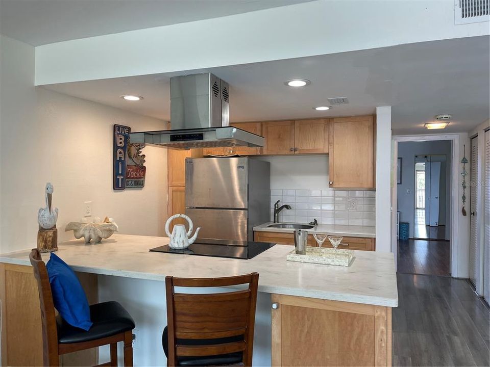 Range hood provides lighting over stove.