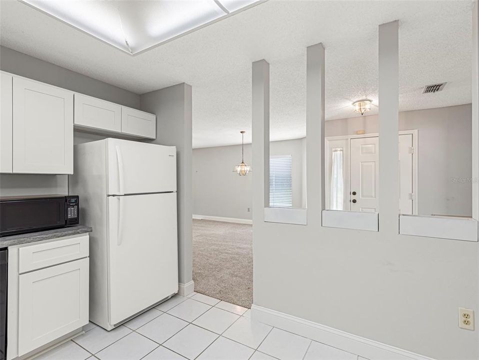 Kitchen view toward entry and dining room area...