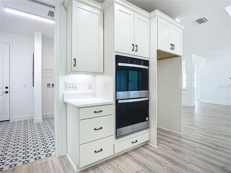 Double Oven with view of Laundry Room