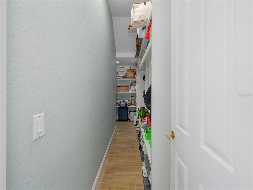 Huge Storage wraps around under the staircase