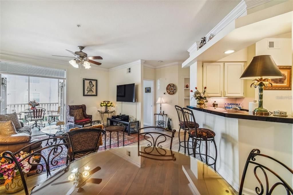 View from dining area toward living room with opened French Doors to patio