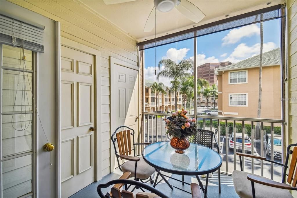 Screened front porch with additional storage