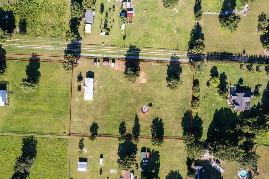 View from above showing the owned driveway to get to the property.