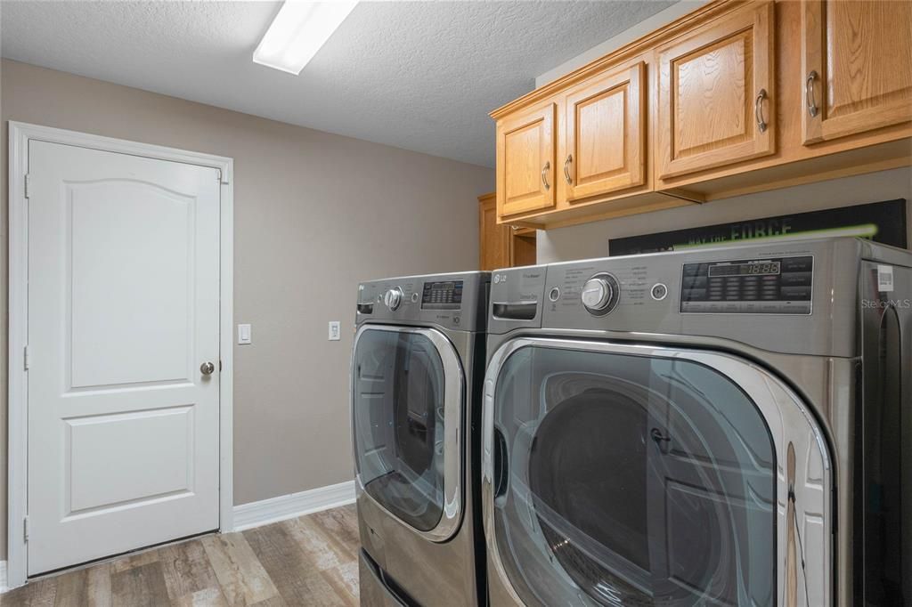 Laundry room with storage and basin sink