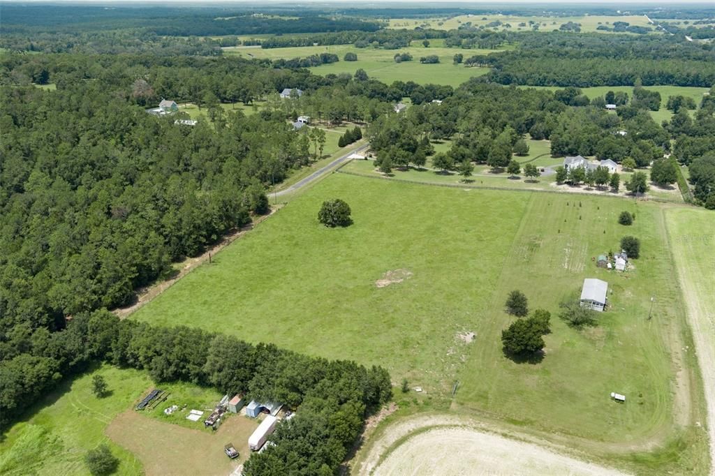 Acreage from south looking north.  You can see fence row on east side if you look carefully.  The mobile home is not part of the sale but will share easement.